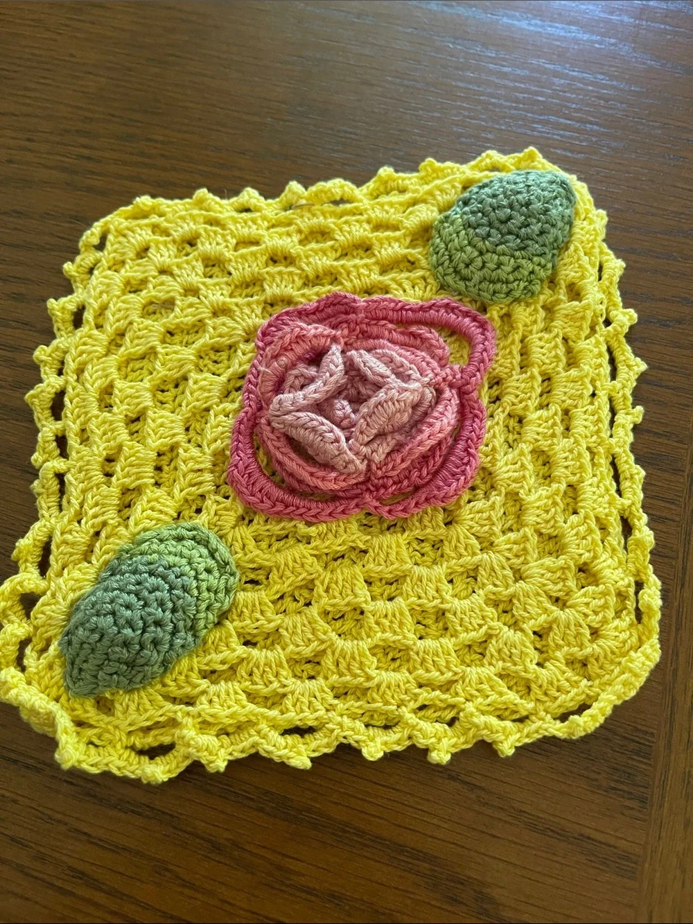 Hand Crafted Yellow Crochet Dishcloth with Pink Flower and Green Accents